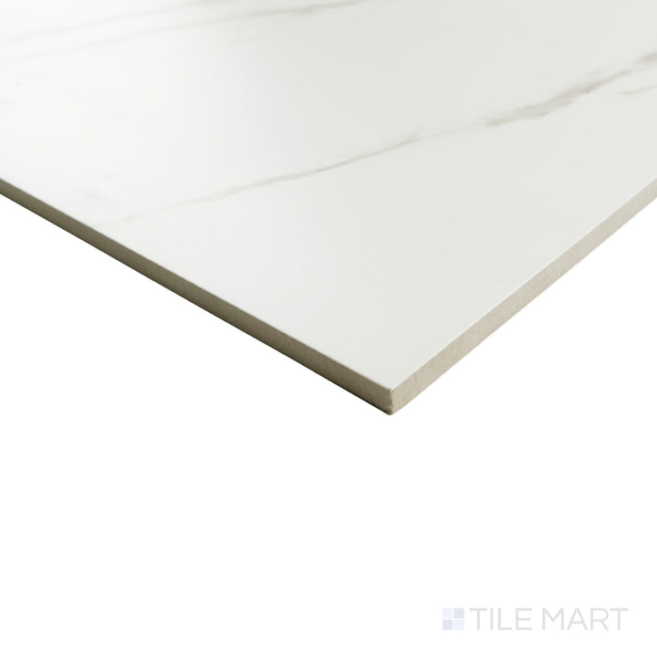 Corner shot of Calacatta Lux Superwhite 24x24 satin tile showing soft veining and a smooth, low-sheen finish along the edge.
