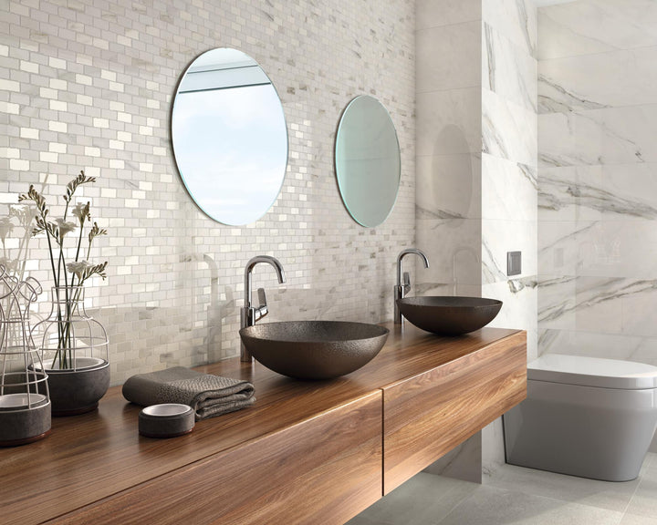 Calacatta Lux Superwhite 24x48 polished tile used in a lifestyle scene, emphasizing scale and dramatic marble patterns.