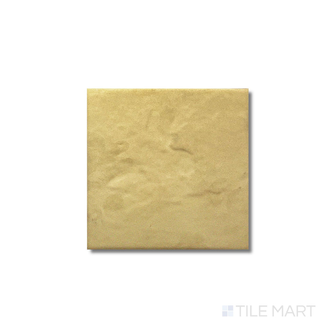 Flat lay of Golden Stone Anti-Slip 6x6 tile showing a matte surface texture with golden earth tones.
