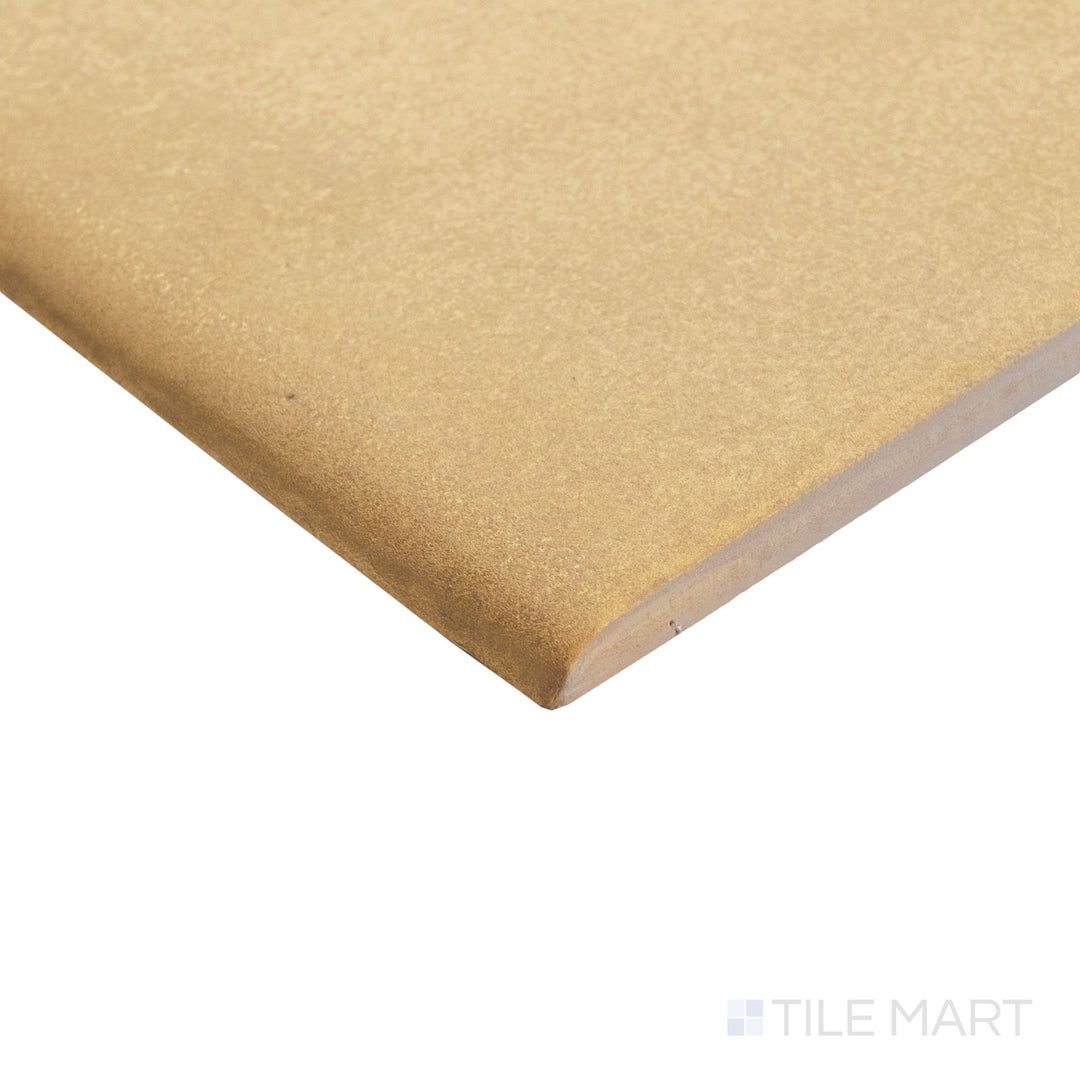 Close-up corner of Golden Stone 6x6 matte porcelain bullnose, highlighting the rounded edge and soft finish transition.