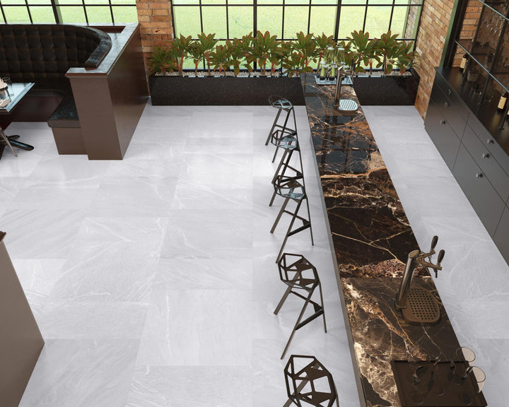 Interior with Pietrasanta Light Grey polished porcelain tile, capturing the sophisticated, high-gloss look of marble in real use.