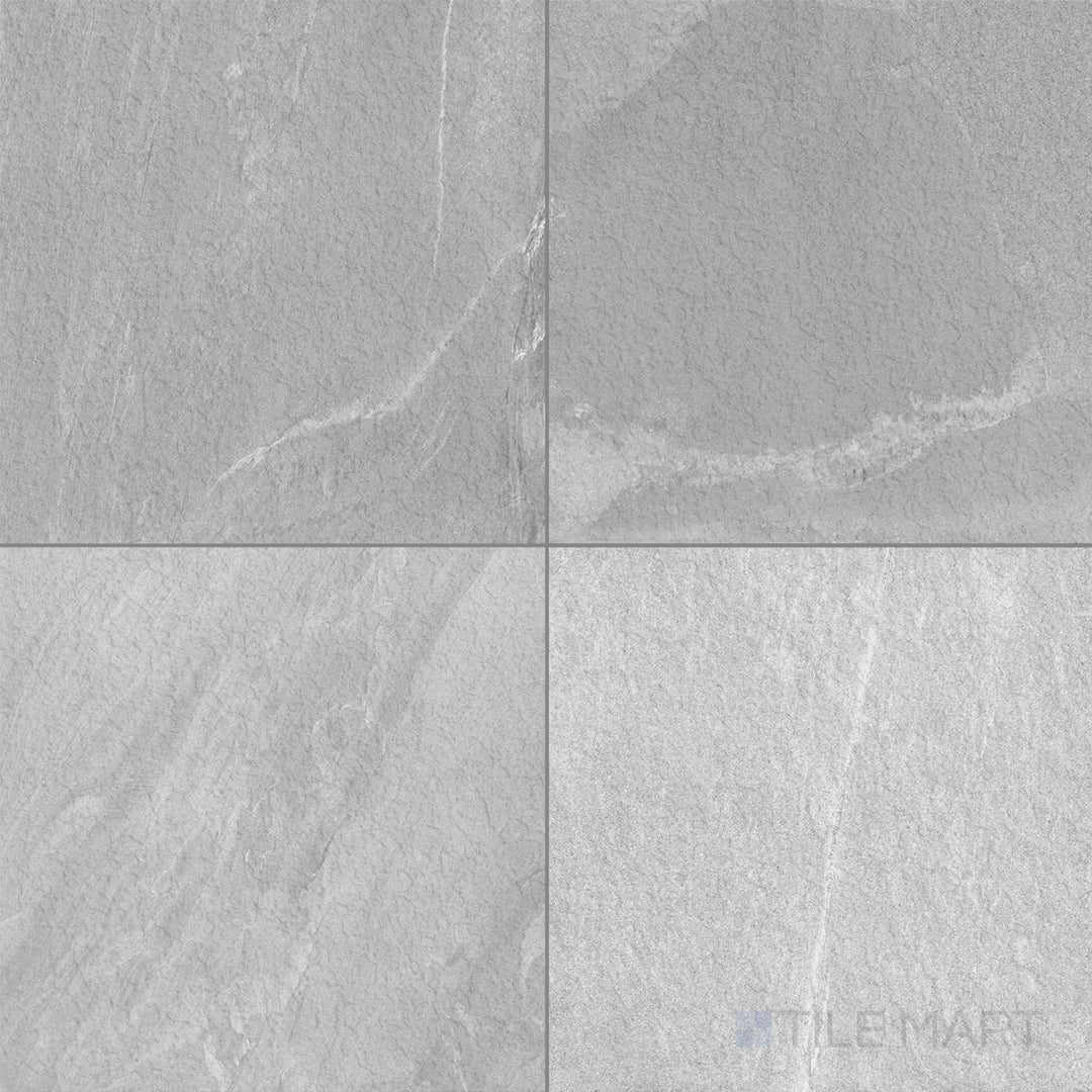 A polished surface and soft light grey tone enhance the refined stone look of this 35x35 Pietrasanta tile.