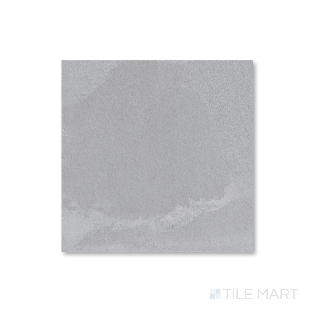 Aerial view of Pietrasanta Light Grey 35x35 tile with polished finish and soft marble-like veining across a light grey base.