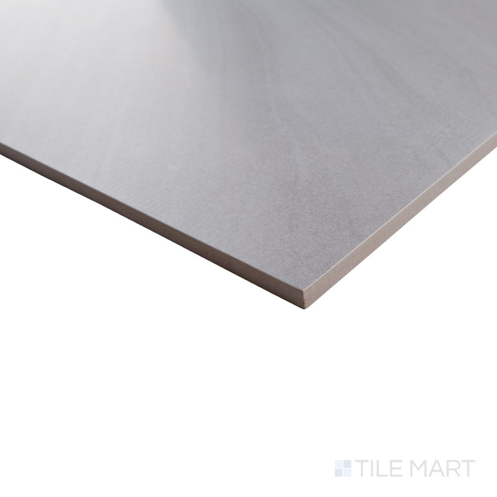 Corner perspective of Pietrasanta Light Grey 35x35 polished tile with elegant veining and a glossy surface along the edge.