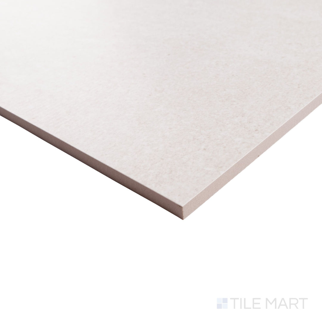 Corner detail of Pietrasanta Ivory 35x35 polished tile highlighting its creamy tone, natural veining, and smooth glossy edge.