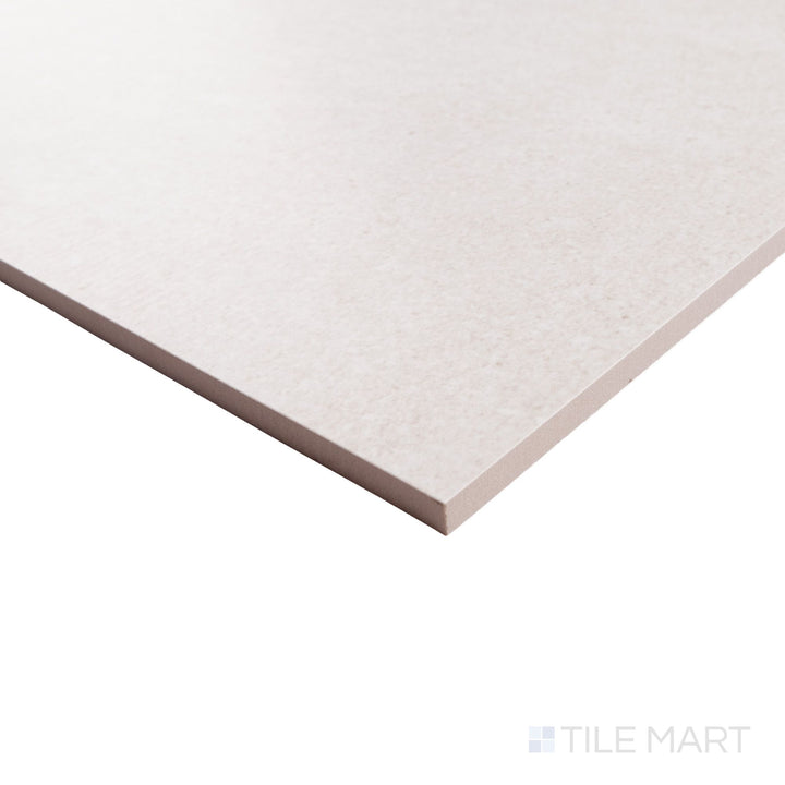 Corner detail of Pietrasanta Ivory 35x35 polished tile highlighting its creamy tone, natural veining, and smooth glossy edge.