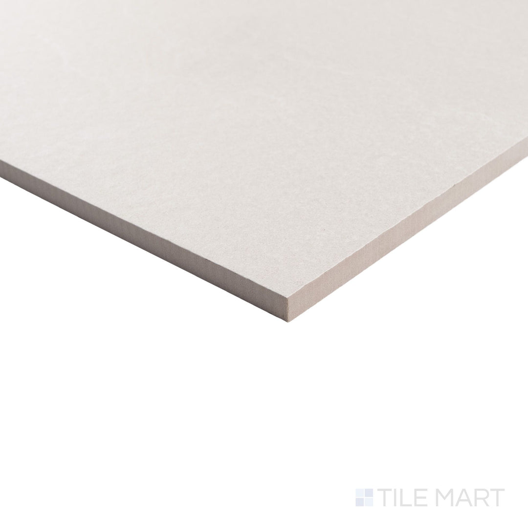 Corner shot of Pietrasanta Ivory Anti-Slip 35x35 matte tile, showing the soft stone pattern and slip-resistant surface.