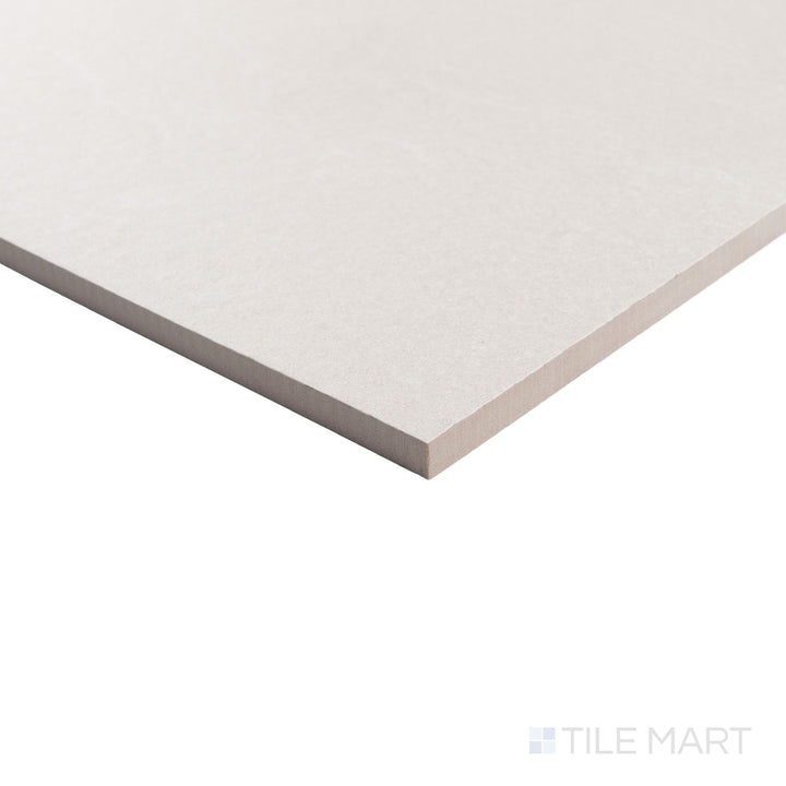 Corner shot of Pietrasanta Ivory Anti-Slip 35x35 matte tile, showing the soft stone pattern and slip-resistant surface.