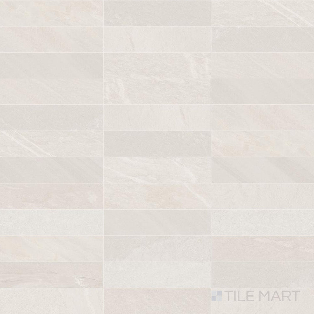 Subtle ivory tones and a long 3x11 format give this matte porcelain tile a soft, linear look.