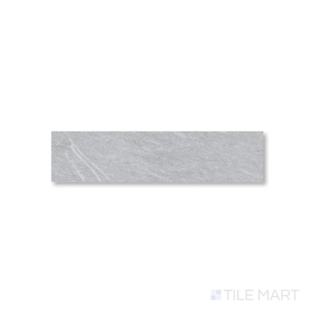 Flat perspective of Pietrasanta Light Grey 3x11 tile showcasing gentle veining on a cool matte surface.