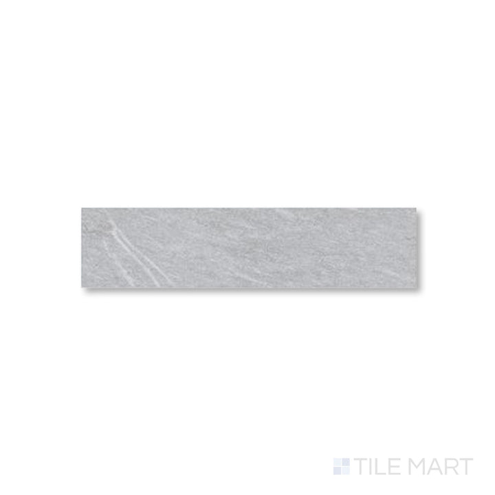 Flat perspective of Pietrasanta Light Grey 3x11 tile showcasing gentle veining on a cool matte surface.