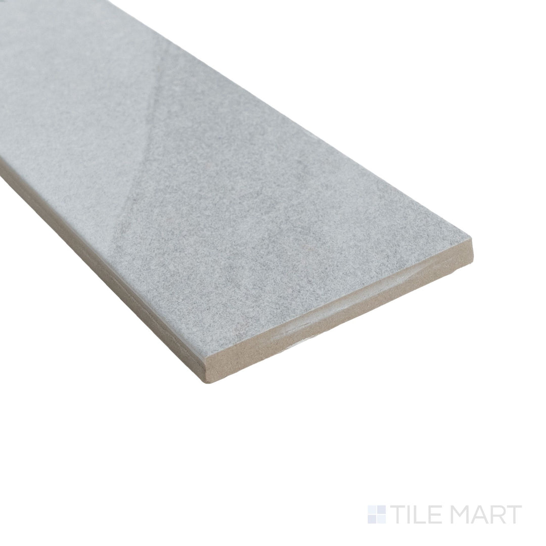 Corner shot of Pietrasanta Light Grey 3x11 matte tile featuring cool grey tones and lightly textured finish.
