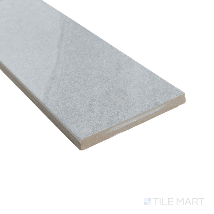 Corner shot of Pietrasanta Light Grey 3x11 matte tile featuring cool grey tones and lightly textured finish.