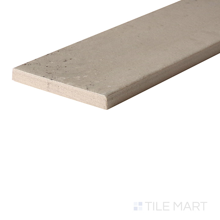 An angled look at the GREIGE EDEN tile, highlighting its glossy finish and the boldness of its warm hue.