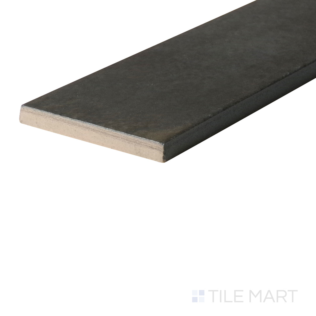 An angled look at the OTTANIO EDEN tile, highlighting its smooth glaze and the boldness of its deep shade.