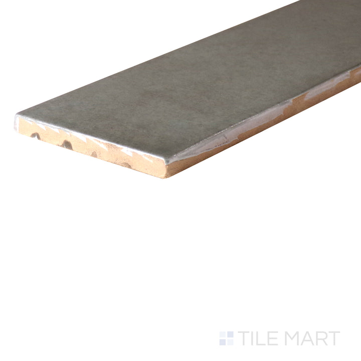 An angled look at the OLIVE HIGHLAND LAKE tile, highlighting its smooth glaze and the boldness of its vivid tint.