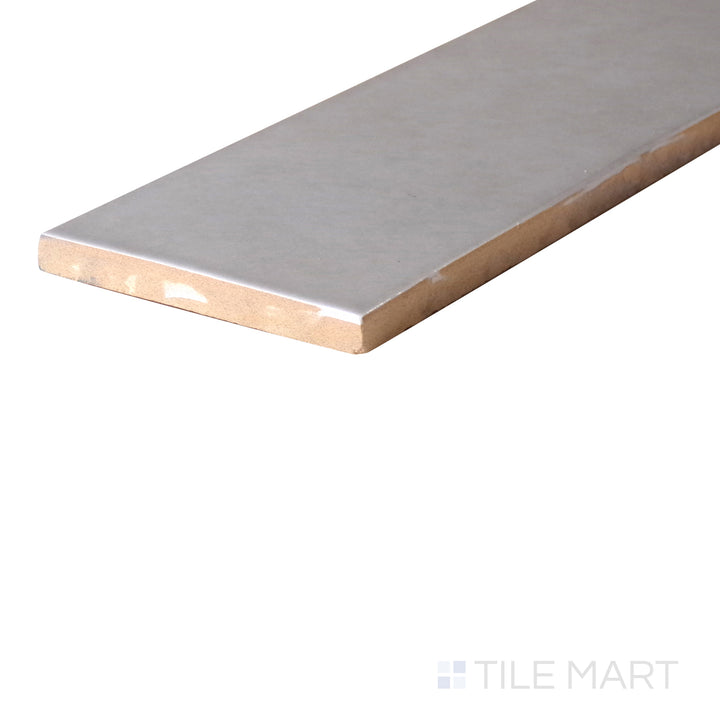 An angled look at the RAIN HIGHLAND LAKE tile, highlighting its matte surface and the boldness of its soft undertone.