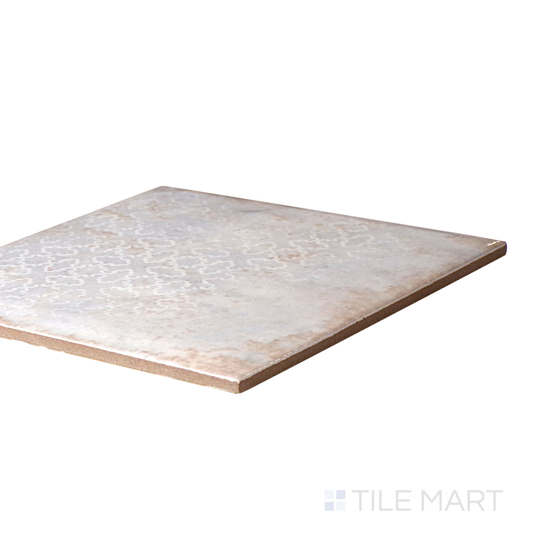 An angled look at the CLOUDY INTERMIX tile, highlighting its reflective sheen and the boldness of its warm hue.