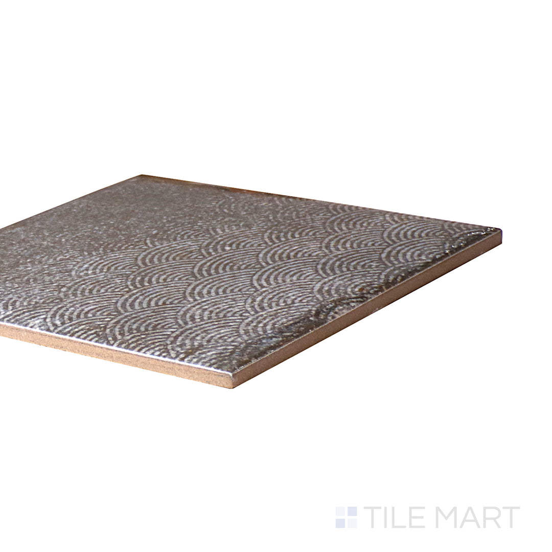 An angled look at the OBSIDIAN INTERMIX tile, highlighting its smooth glaze and the boldness of its vivid tint.