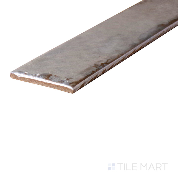 An angled look at the ASHEN ORGANIC CLAY tile, highlighting its reflective sheen and the boldness of its warm hue.