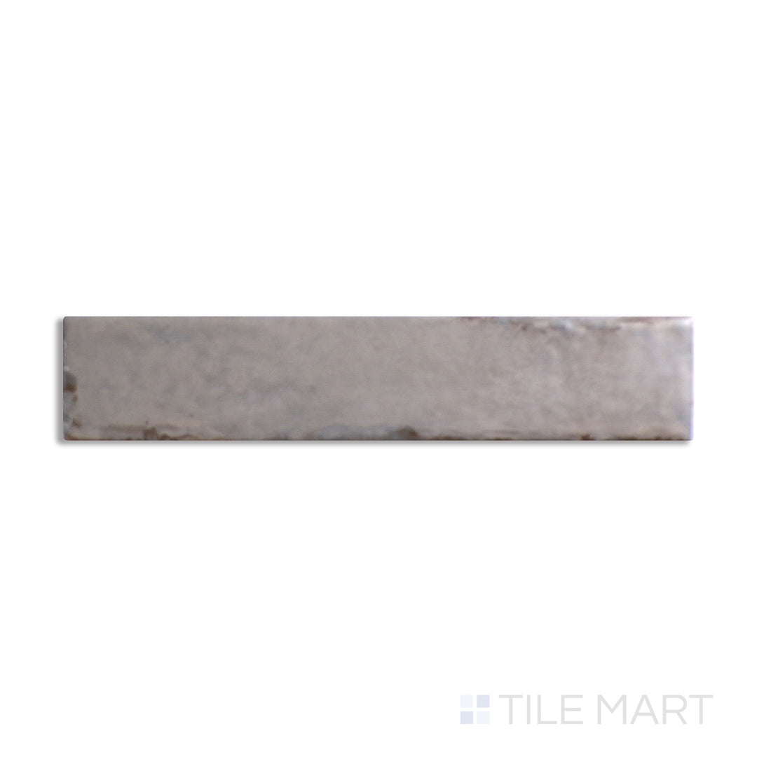 Aerial shot showcasing the ASHEN ORGANIC CLAY tile, sized 2x10, with a glossy finish that enhances its deep shade.