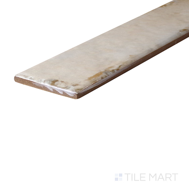 An angled look at the SAND ORGANIC CLAY tile, highlighting its glossy finish and the boldness of its rich pigment.