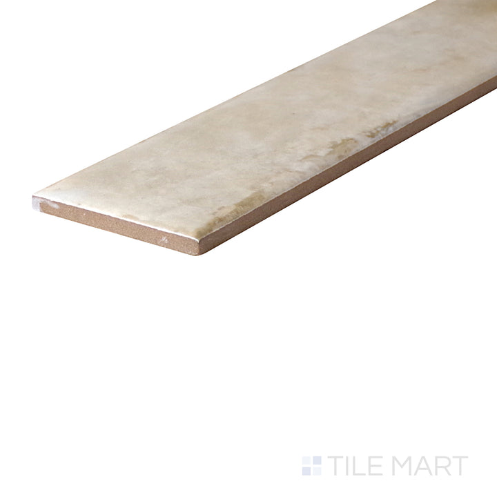 An angled look at the SAND ORGANIC CLAY tile, highlighting its reflective sheen and the boldness of its warm hue.