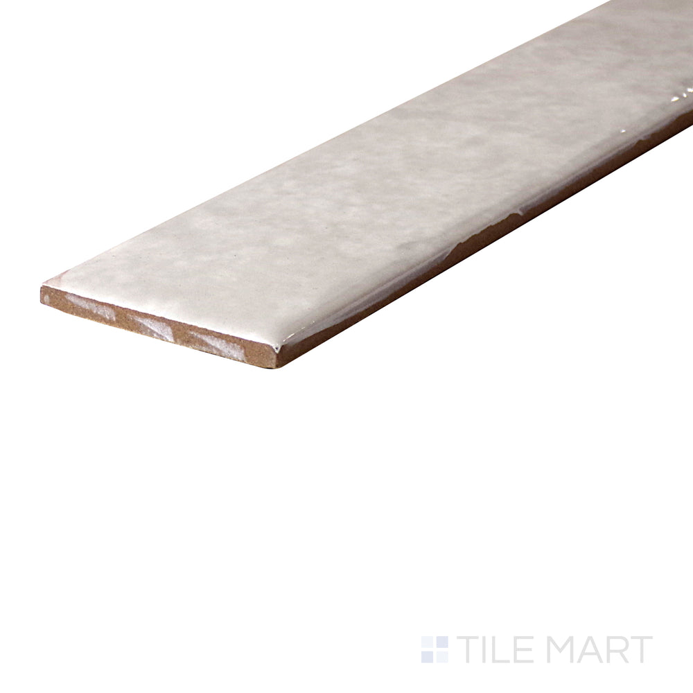 An angled look at the STEAM ORGANIC CLAY tile, highlighting its glossy finish and the boldness of its soft undertone.