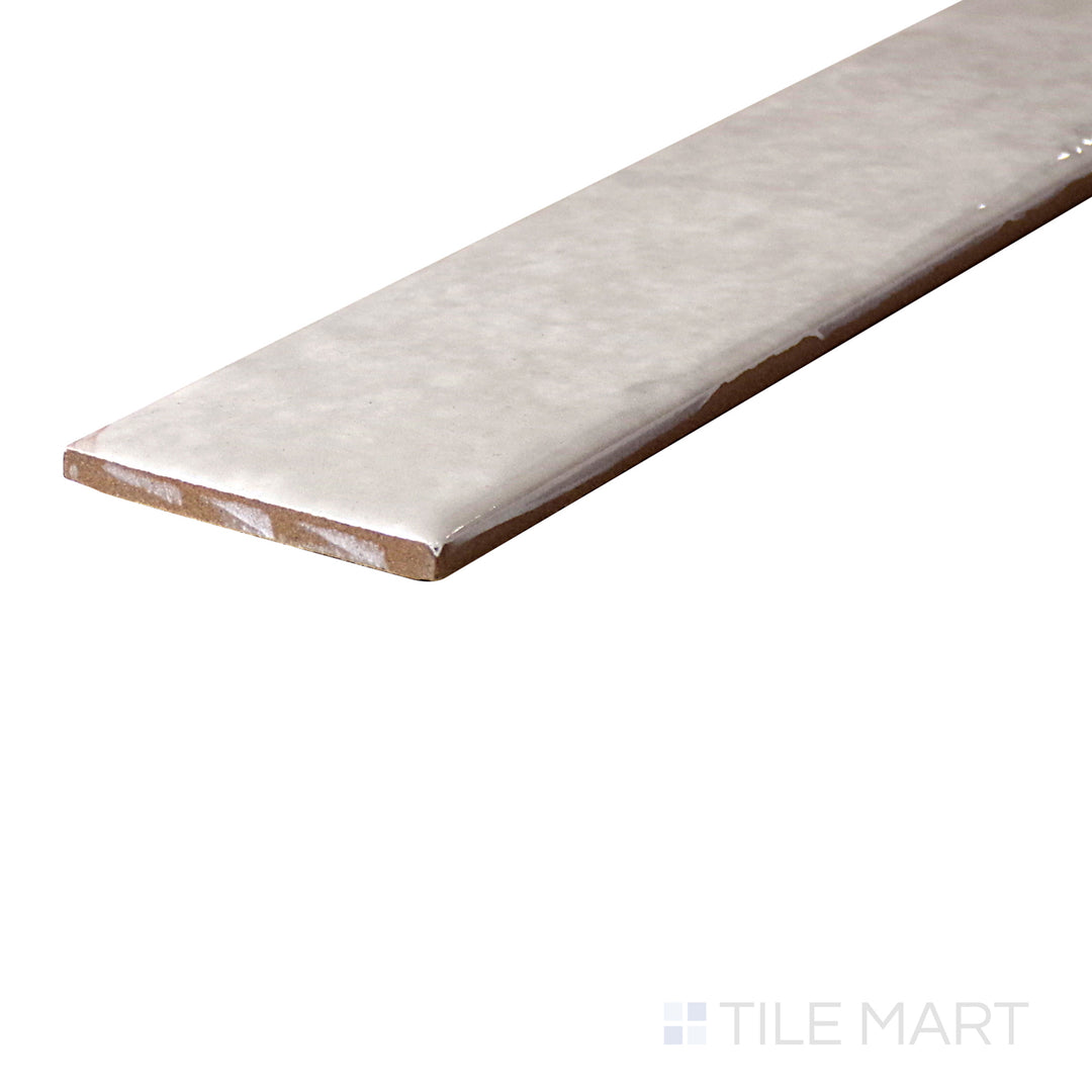 An angled look at the STEAM ORGANIC CLAY tile, highlighting its glossy finish and the boldness of its soft undertone.