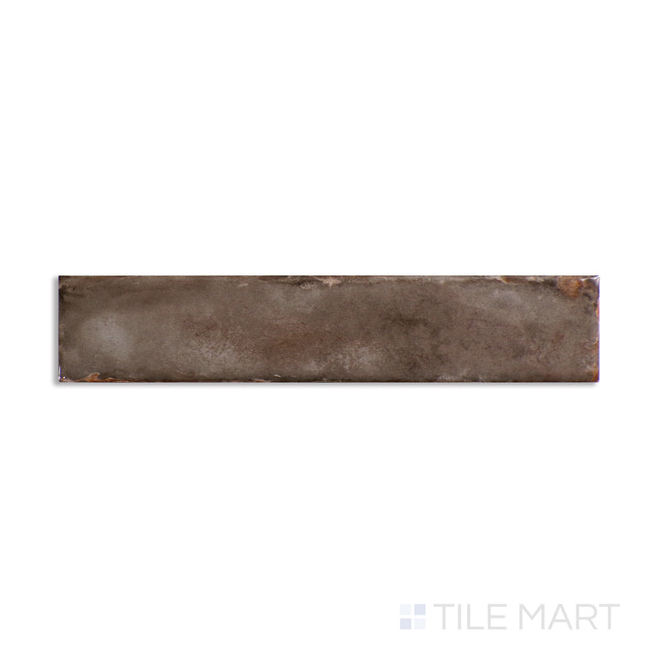 Top angle showcasing the TAUPE ORGANIC CLAY tile, sized 2x10, with a reflective sheen that enhances its soft undertone.