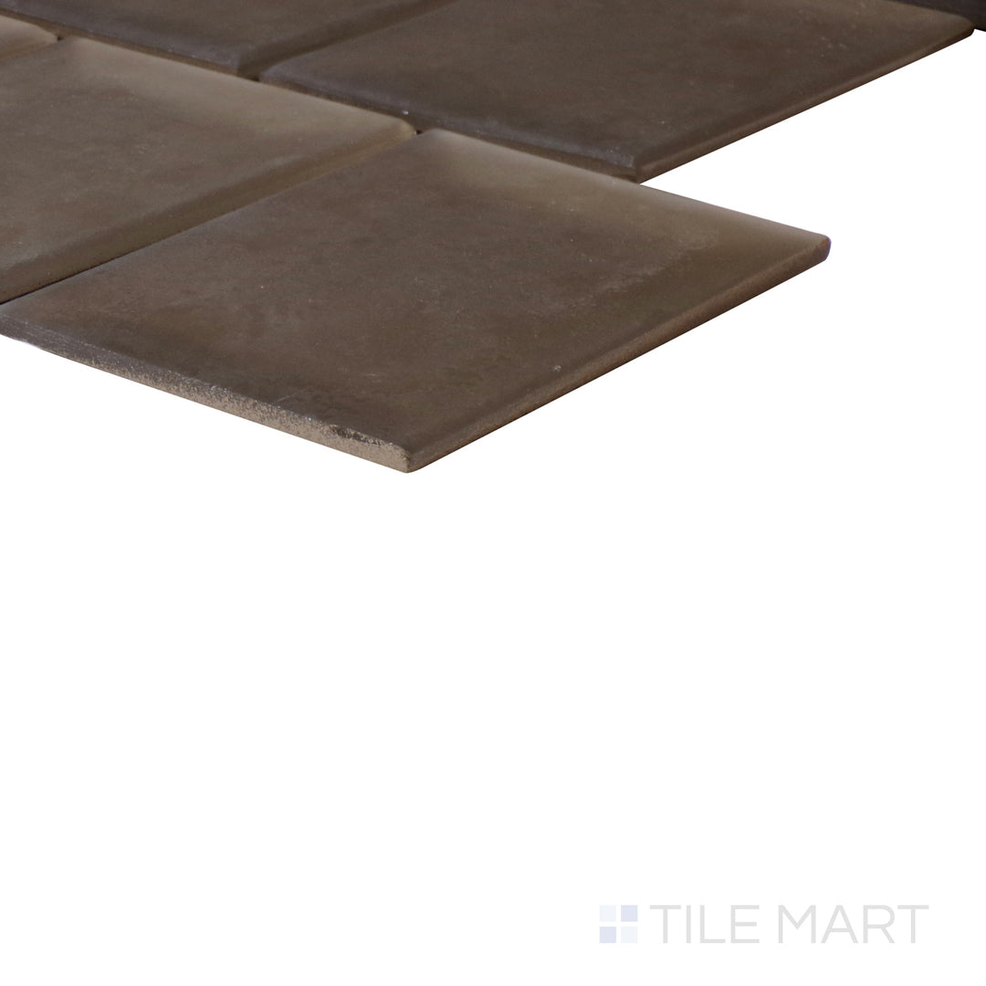 An angled look at the BRONZE HAS MORE FUN PRISM tile, highlighting its textured coating and the boldness of its rich pigment.