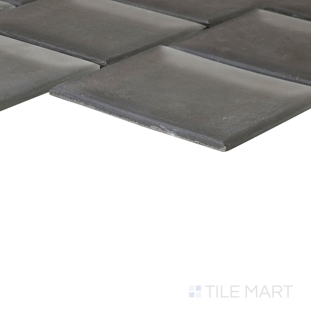 An angled look at the SAGE YOU LOVE ME PRISM tile, highlighting its smooth glaze and the boldness of its soft undertone.