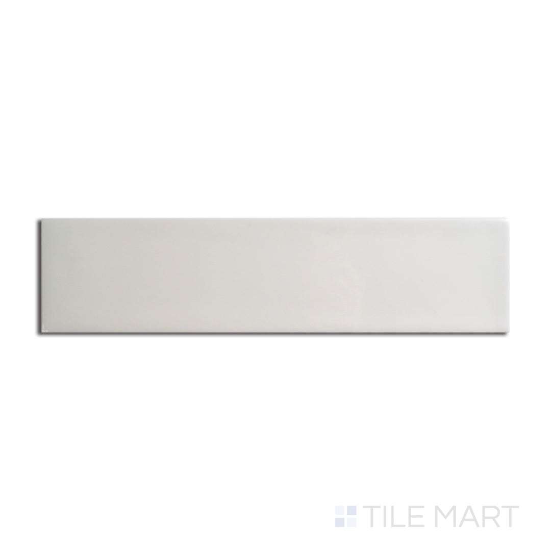 Top angle showcasing the CREME ZEN tile, sized 3x12, with a reflective sheen that enhances its warm hue.