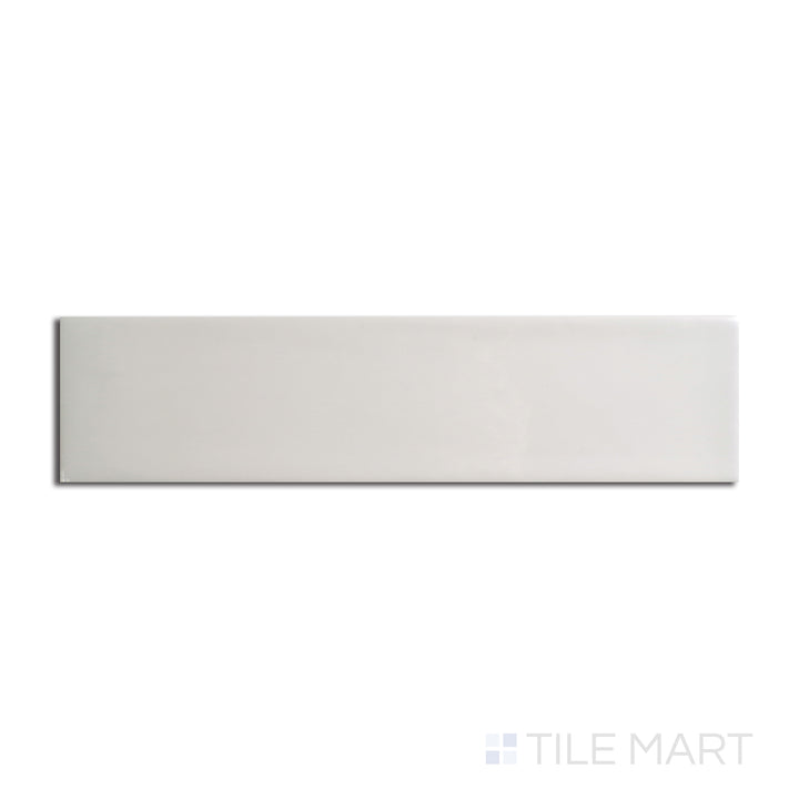 Top angle showcasing the CREME ZEN tile, sized 3x12, with a reflective sheen that enhances its warm hue.