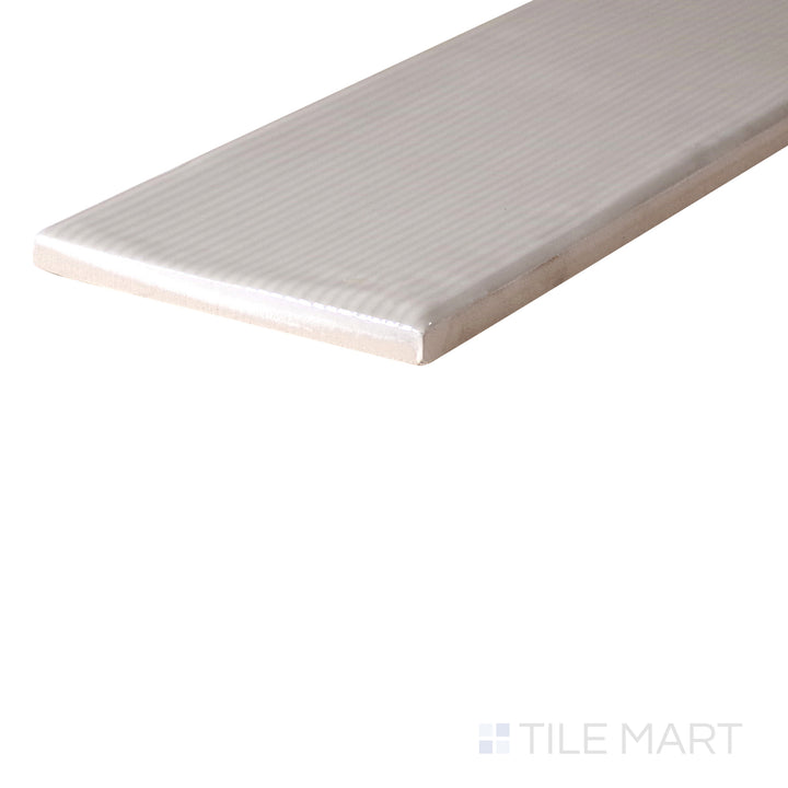 An angled look at the GREIGE ZEN tile, highlighting its glossy finish and the boldness of its deep shade.