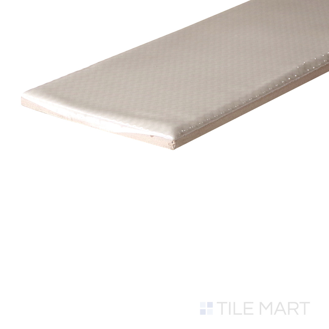 An angled look at the MORNING ZEN tile, highlighting its textured coating and the boldness of its warm hue.