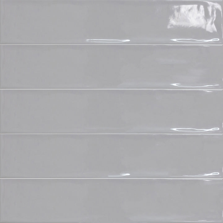 Bird's eye view showcasing the gris perla maui tile, sized 4.3x21, with a smooth glaze that enhances its rich pigment.