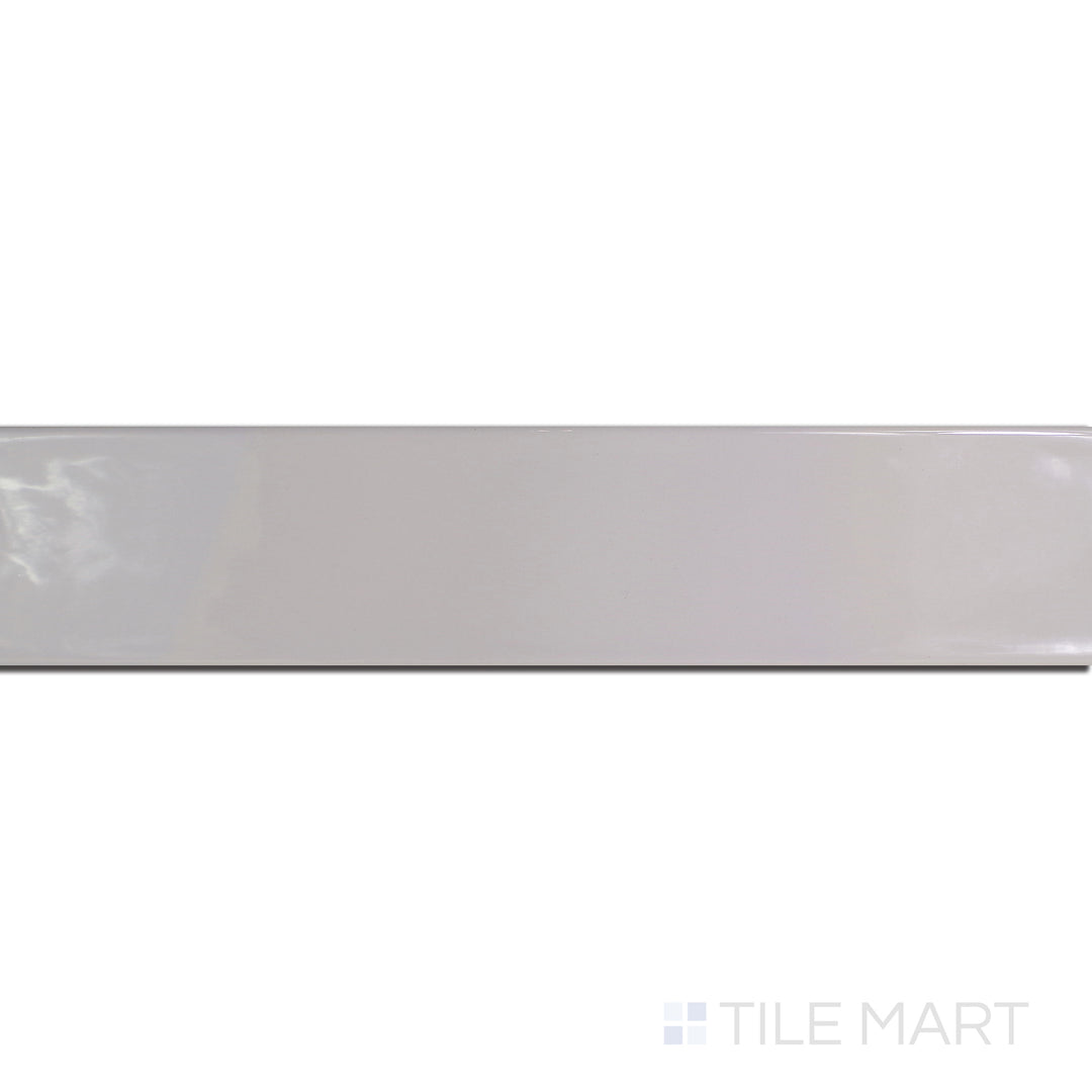 An angled look at the gris perla maui tile, highlighting its glossy finish and the boldness of its rich pigment.