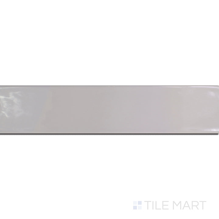 An angled look at the gris perla maui tile, highlighting its glossy finish and the boldness of its rich pigment.