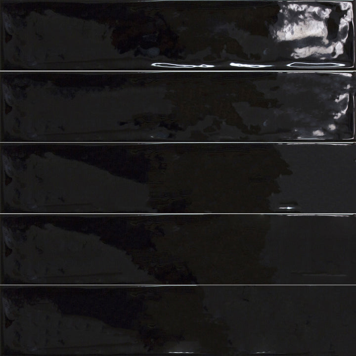 Above shot showcasing the negro maui tile, sized 4.3x21, with a smooth glaze that enhances its warm hue.