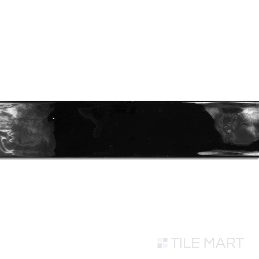 An angled look at the negro maui tile, highlighting its glossy finish and the boldness of its deep shade.