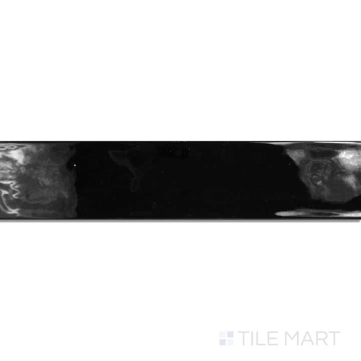 An angled look at the negro maui tile, highlighting its glossy finish and the boldness of its deep shade.