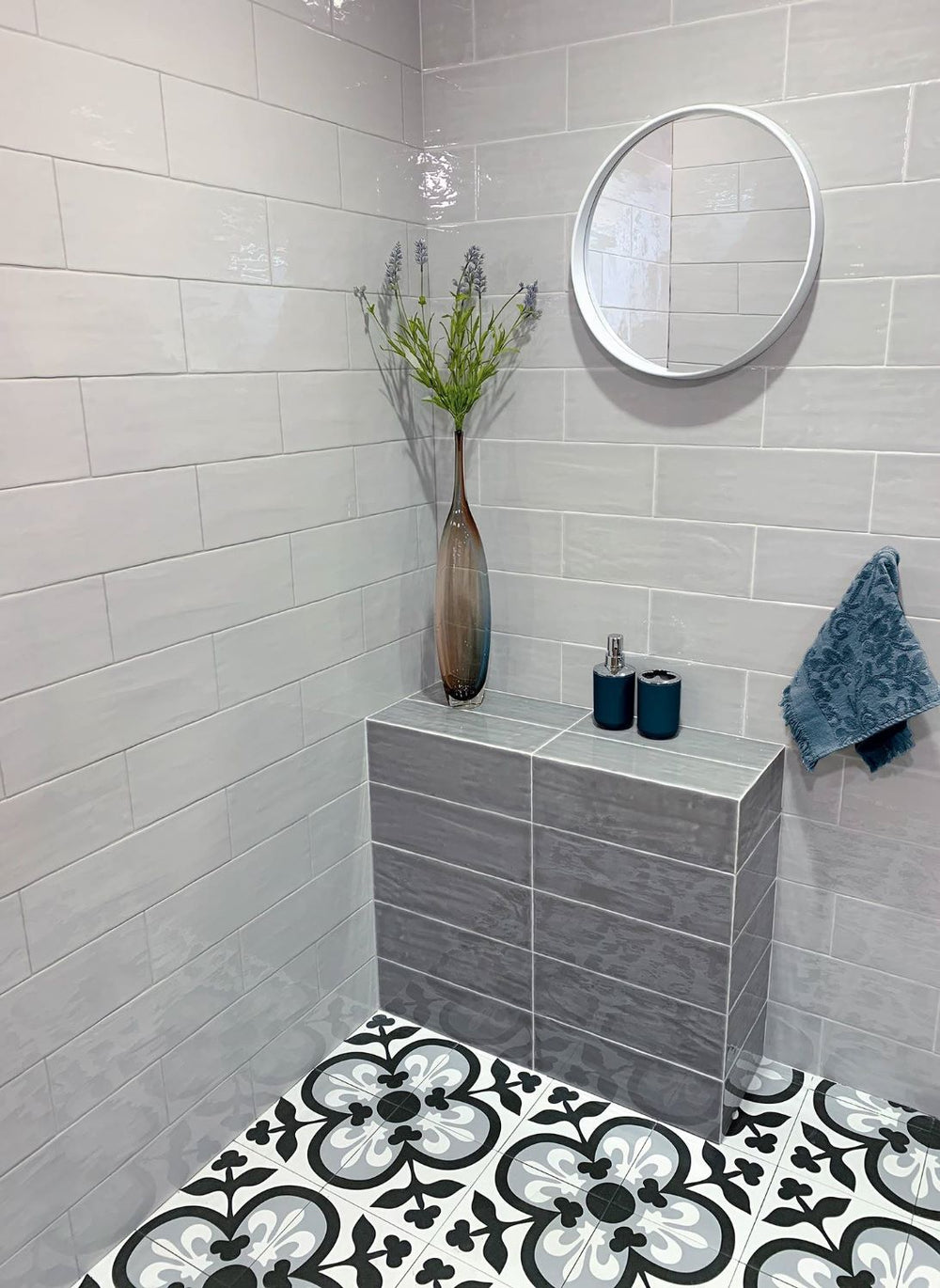A contemporary decor, featuring marengo madrid tile with a glossy texture, bringing a sleek look to the room.