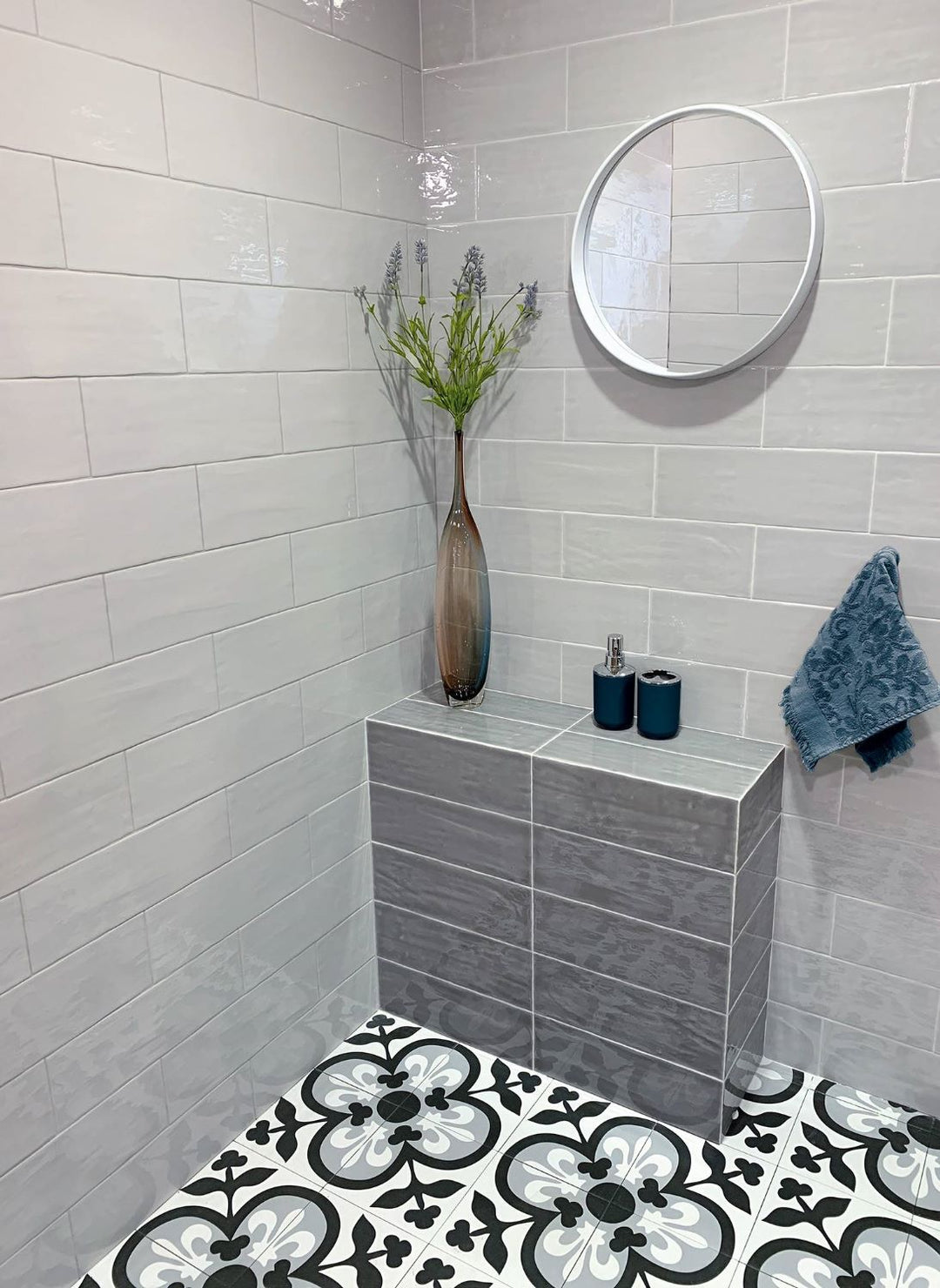 A contemporary decor, featuring marengo madrid tile with a glossy texture, bringing a sleek look to the room.