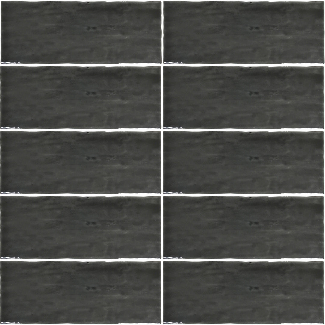 Top angle showcasing the grafito madrid tile, sized 5x14, with a reflective sheen that enhances its rich pigment.