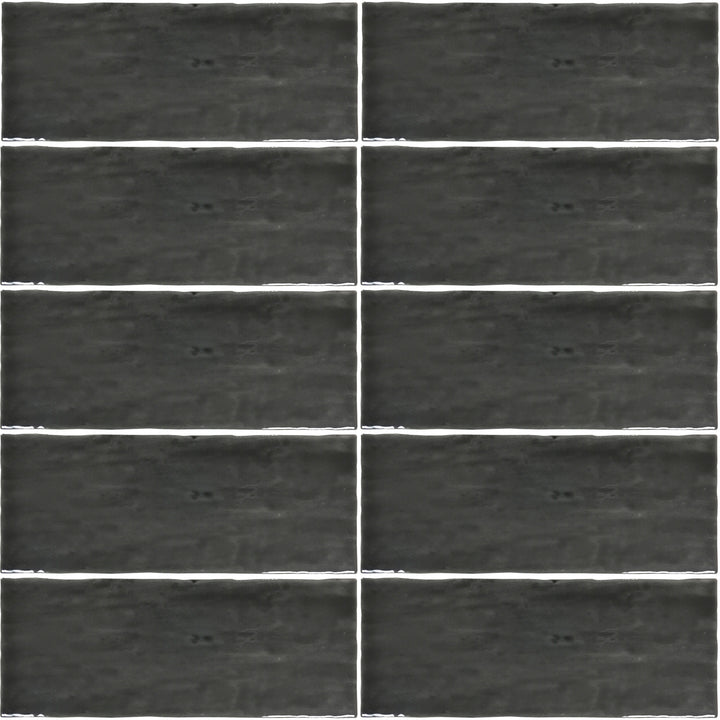 Top angle showcasing the grafito madrid tile, sized 5x14, with a reflective sheen that enhances its rich pigment.