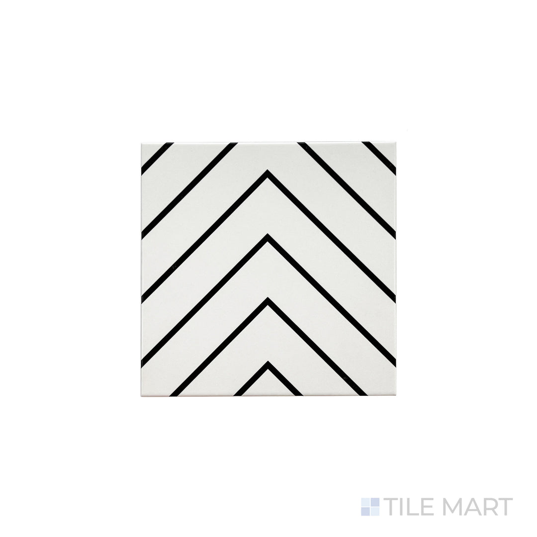 An angled look at the white with black studio tile, highlighting its smooth glaze and the boldness of its soft undertone.