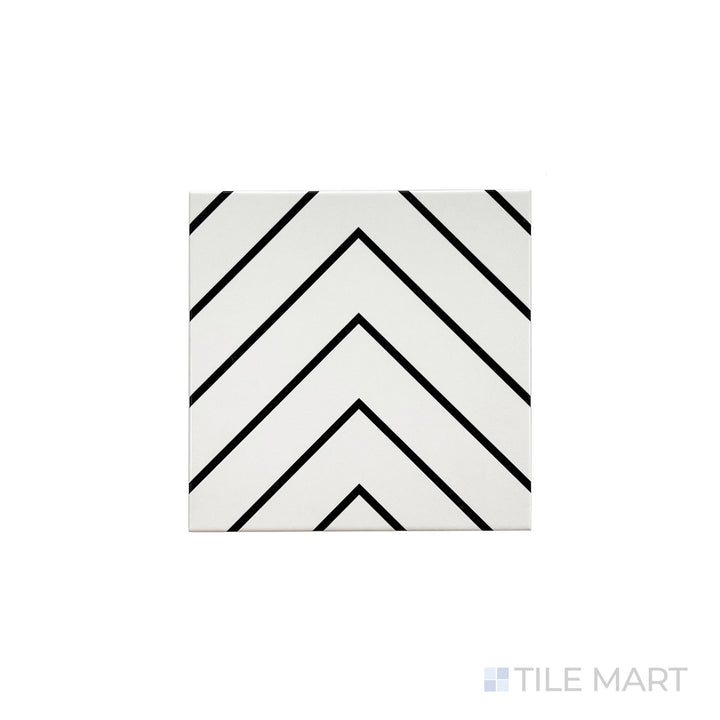 An angled look at the white with black studio tile, highlighting its smooth glaze and the boldness of its soft undertone.