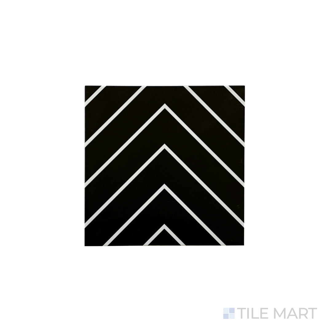 An angled look at the black with white studio tile, highlighting its smooth glaze and the boldness of its soft undertone.