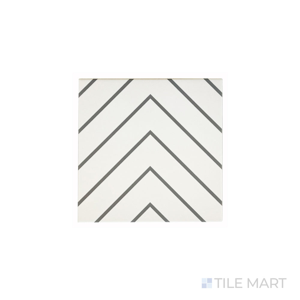 An angled look at the white with grey studio tile, highlighting its smooth glaze and the boldness of its deep shade.